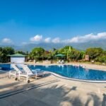 This hotel in jim corbett offers private balconies with stunning views and cozy bonfire nights, perfect for unwinding